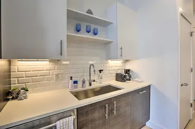 a kitchen with a sink and a counter top at Downtown Denver Studio Less Than 1 Mi to Coors Field! in Denver
