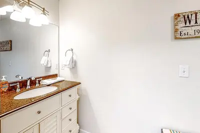 a bathroom with a sink and a mirror at Snowblaze Studio in Winter Park