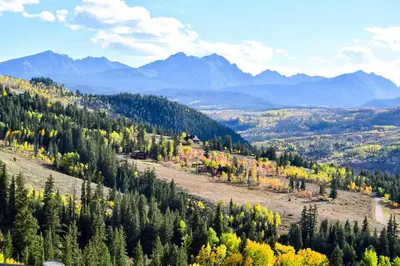 a mountain with trees and mountains in the background at Buffalo Woods 216 - Wildernest in Silverthorne