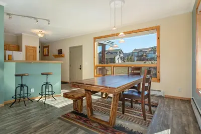 a dining room with a table and chairs and a window at Lake Ridge at Lake Dillon in Dillon