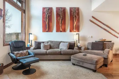 a living room with a couch and a chair at Rolling Ridge 20C - Wildernest in Silverthorne