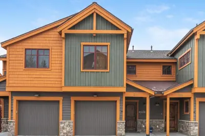 a house with two garage doors in front of it at Rolling Ridge 20C - Wildernest in Silverthorne