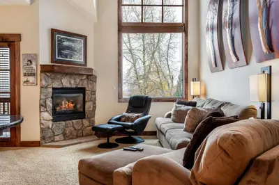 a living room with a couch and a fireplace at Rolling Ridge 20C - Wildernest in Silverthorne