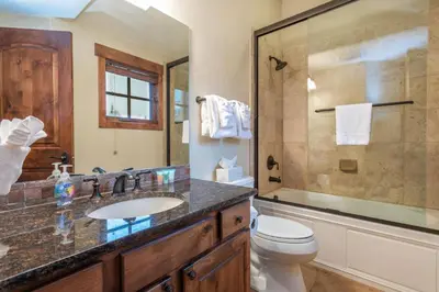 a bathroom with a sink and a shower and a toilet at Rolling Ridge 20C - Wildernest in Silverthorne