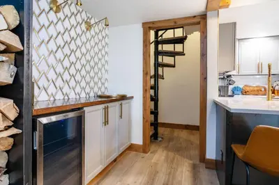 a kitchen with white cabinets and a wooden counter top at Wild Irishman 1027 - Keystone in Keystone