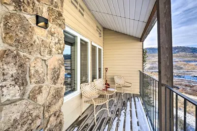 a porch with chairs and a bench on a balcony at Ski-InandSki-Out Granby Ranch Home Mountain Views! in Granby
