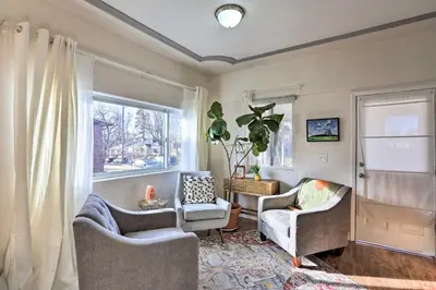 a living room with two chairs and a window at half Mi to Tennyson Pet-Friendly Denver Gem in Denver
