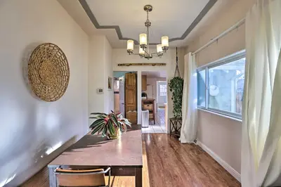 a dining room with a table and a large window at half Mi to Tennyson Pet-Friendly Denver Gem in Denver