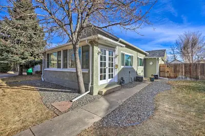 a small house with a tree in a yard at half Mi to Tennyson Pet-Friendly Denver Gem in Denver