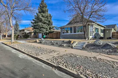 a house with a christmas tree on the side of the road at half Mi to Tennyson Pet-Friendly Denver Gem in Denver