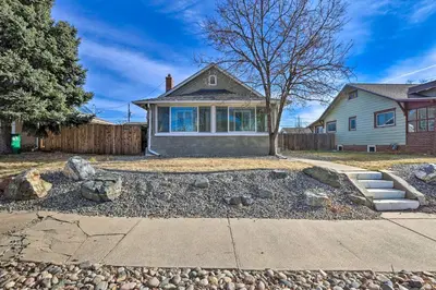 a home with a driveway and a house at half Mi to Tennyson Pet-Friendly Denver Gem in Denver