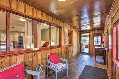 a train room with two chairs and a desk at Wildmanor Ranch Near Red Rocks with Hot Tub! in Morrison