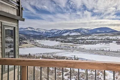 a view from a balcony with snow covered mountains at Stunning Condo in Fraser with Mountain Views! in Fraser