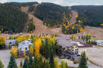an aerial view of a house in the forest at 2754 Slopeside condo in Keystone