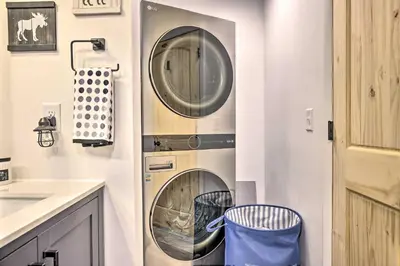 a kitchen with two washing machines in a wall at 1 Mi to St Marys Glacier Trail Modern Mtn Cabin! in Idaho Springs