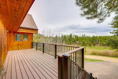 a wooden deck on the side of a house at Dreamy Escape Btwn Winter Park and Lake Granby! in Tabernash