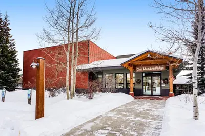 a red brick building with snow in front of it at Railbender 8 in Fraser