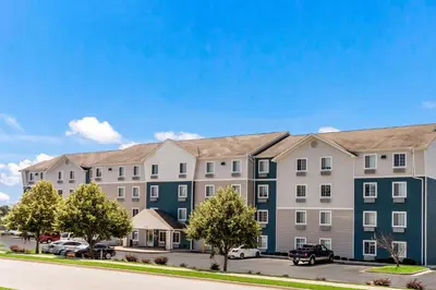 a rendering of a apartment building with cars parked outside at Extended Stay America Select Suites - Firestone in Firestone