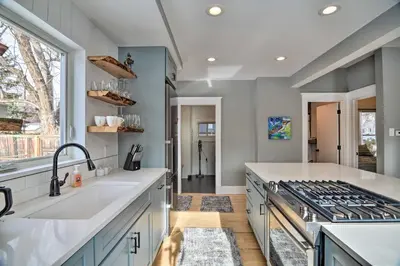 a kitchen with a sink and a stove at Contemporary Longmont Hideaway in Old Town! in Longmont