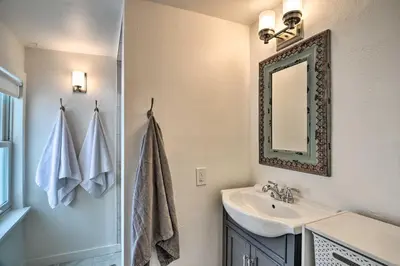 a bathroom with a sink and a mirror at Contemporary Longmont Hideaway in Old Town! in Longmont