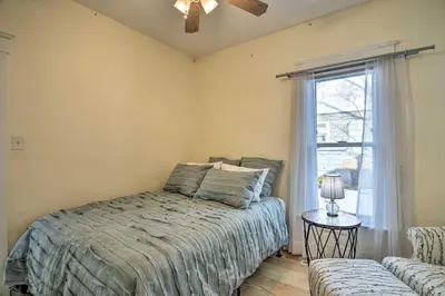 a bedroom with a bed and a window at Contemporary Longmont Hideaway in Old Town! in Longmont