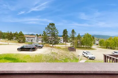 a couple of cars parked in a parking lot at Fraser Family Getaway in Fraser