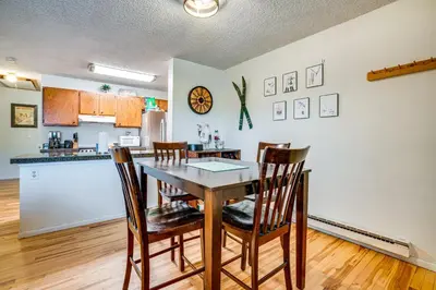 a kitchen and dining room with a table and chairs at Walk to Main St Recently Renovated Frisco Condo in Frisco