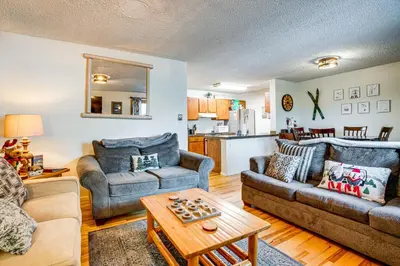 a living room with two couches and a table at Walk to Main St Recently Renovated Frisco Condo in Frisco