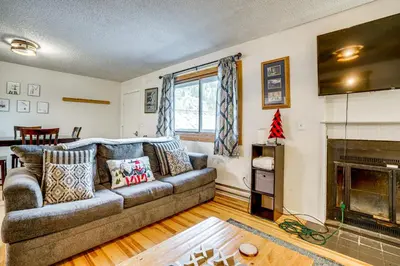 a living room with a couch and a fireplace at Walk to Main St Recently Renovated Frisco Condo in Frisco