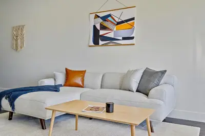 a living room with a couch and a coffee table at A Denver Skyline State of Mind - Zuni Lofts in Denver