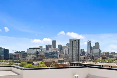 a view of a city skyline from a building at A Denver Skyline State of Mind - Zuni Lofts in Denver