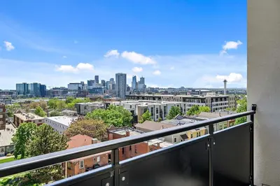 a balcony with a view of a city at A Denver Skyline State of Mind - Zuni Lofts in Denver