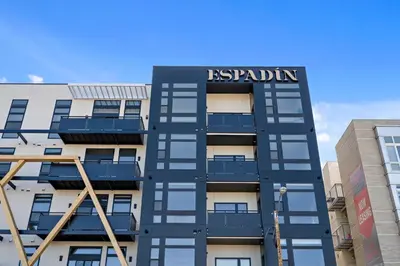 a building with a sign on the side of it at A Denver Skyline State of Mind - Zuni Lofts in Denver