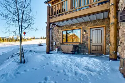 a stone house in the snow at Central Fraser Condo 8 Mi to Winter Park Ski! in Fraser