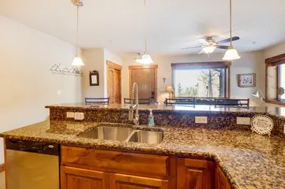 a kitchen with a sink and a counter top at Central Fraser Condo 8 Mi to Winter Park Ski! in Fraser