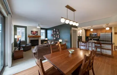 a living room and dining room with a wooden table at Winter Park FF Premium Rated Condo 4340 in Winter Park