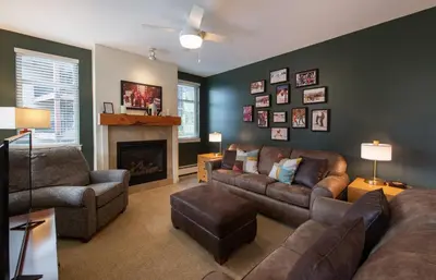 a living room with a couch and a fireplace at Winter Park FF Premium Rated Condo 4340 in Winter Park
