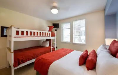 a bedroom with two beds and a bunk bed at Winter Park FF Premium Rated Condo 4340 in Winter Park