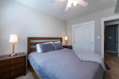 a bedroom with a bed and a ceiling fan at Excellent townhome style condo - Close to the Gondola - Fraser Crossing Founder Pointe condo in Winter Park
