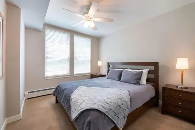 a bedroom with a bed and a ceiling fan at Excellent townhome style condo - Close to the Gondola - Fraser Crossing Founder Pointe condo in Winter Park