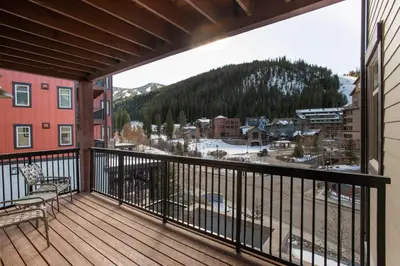 a balcony with a view of a snow covered mountain at Simple and Comfortable Fraser Crossing Founders Pointe Condo Facing Ski Resort condo in Winter Park