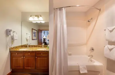 a bathroom with a shower and a tub and a sink at Wonderful Zephyr Mountain Lodge condo with forest views - close to gondola condo in Winter Park