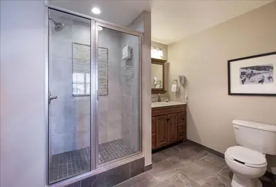 a bathroom with a shower and a toilet at Zephyr Mountain Lodge - Premium Rated Condo 1217 in Winter Park