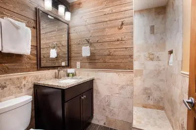 a bathroom with a toilet and a sink at Premium Ski-Slope View Two Bedroom Zephyr Mountain Lodge Condo condo in Winter Park