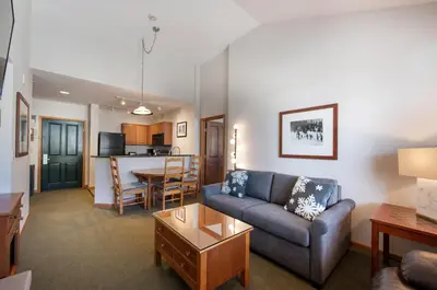 a living room with a couch and a table at Comfortable Mountain Adventure Condo at Zephyr Mountain Lodge with Village View condo in Winter Park