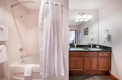 a bathroom with a tub and a shower with a shower curtain at Comfortable Mountain Adventure Condo at Zephyr Mountain Lodge with Village View condo in Winter Park