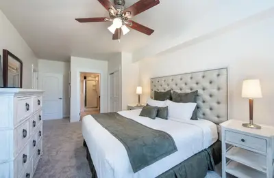 a bedroom with a large bed and a ceiling fan at Comfortable Fraser Crossing Founders Pointe Condo with Easy Access to the Gondola condo in Winter Park