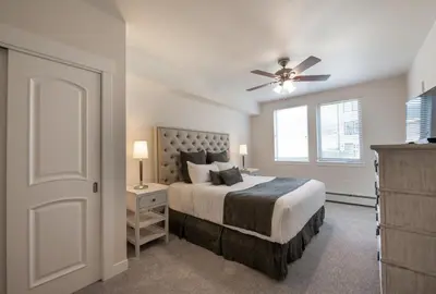 a bedroom with a bed and a ceiling fan at Comfortable Fraser Crossing Founders Pointe Condo with Easy Access to the Gondola condo in Winter Park
