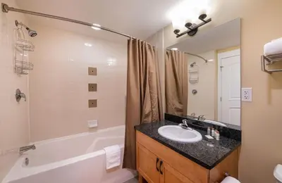 a bathroom with a sink and a bath tub and a sink at Winter Park FF Select Rated Condo 4654 in Winter Park