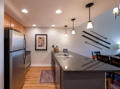 a kitchen with a sink and a refrigerator at Winter Park FF Select Rated Condo 4654 in Winter Park